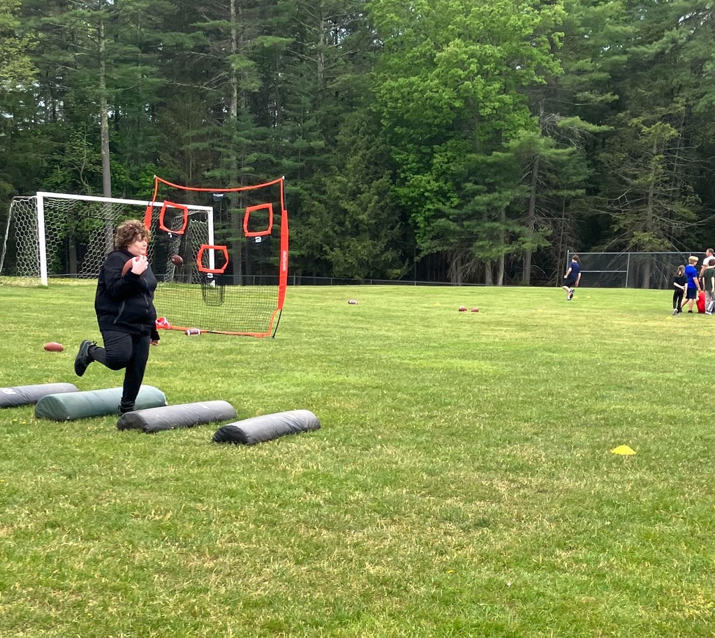 Image of a student running a drill in football club