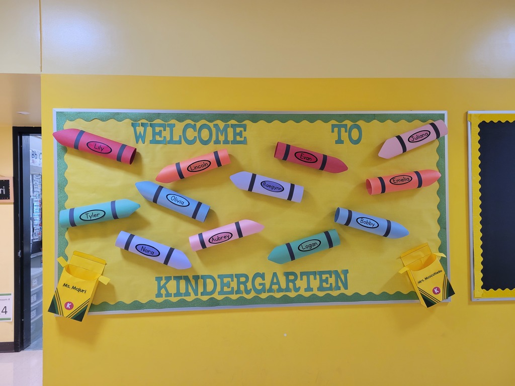 Kindergarten Bulletin Board Yellow background with different color crayons 